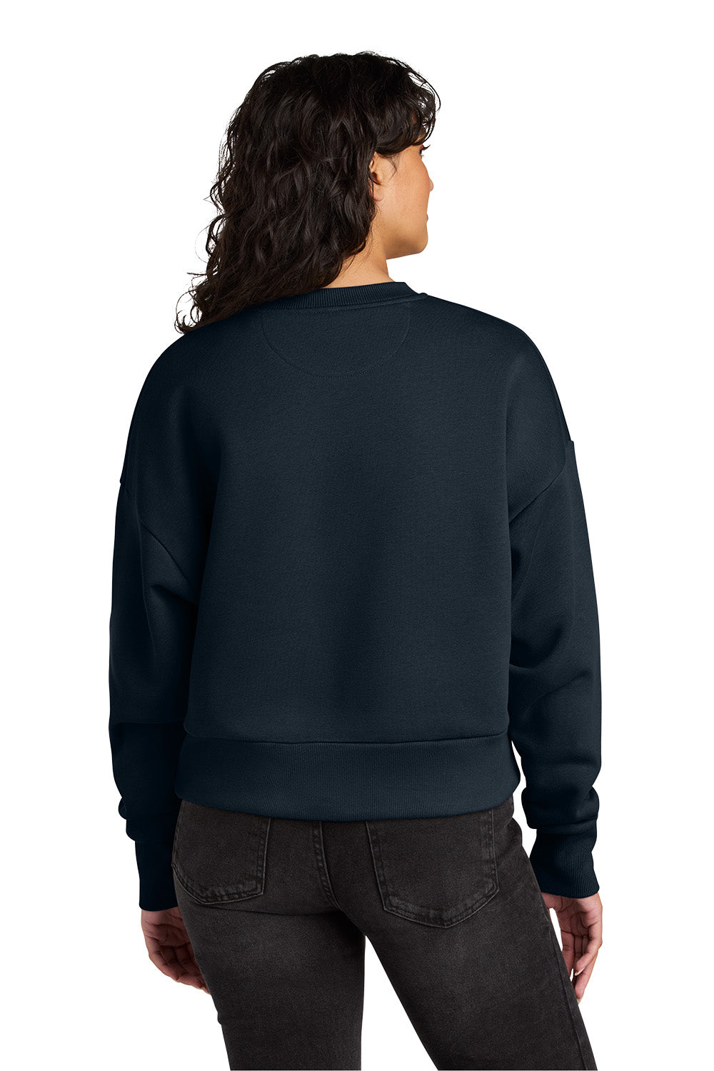 Person wearing a navy blue sweatshirt on a white background. Next Level Apparel® Women’s Heavyweight Sweatshirt, Embroidered
