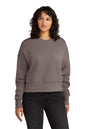 Woman wearing a gray sweatshirt and black pants on a white background. Next Level Apparel® Women’s Heavyweight Sweatshirt, Embroidered