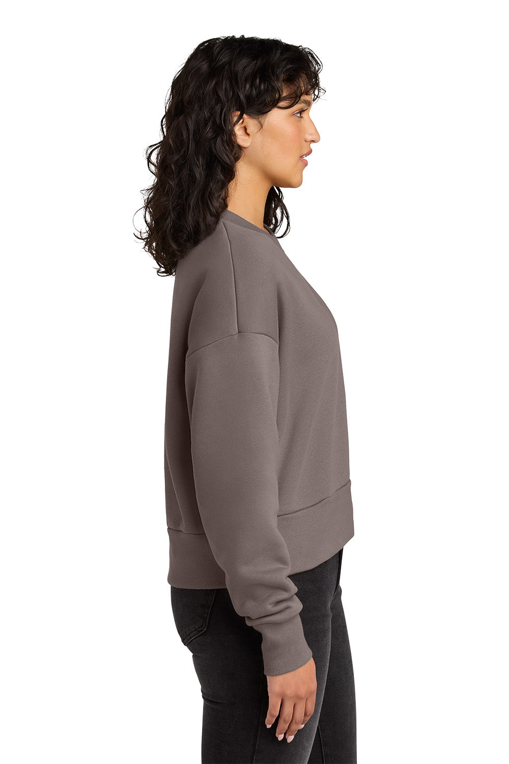 Woman wearing a gray sweatshirt on a white background. Next Level Apparel® Women’s Heavyweight Sweatshirt, Embroidered