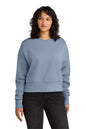 Woman wearing a light blue sweatshirt on a white background. Next Level Apparel® Women’s Heavyweight Sweatshirt, Embroidered