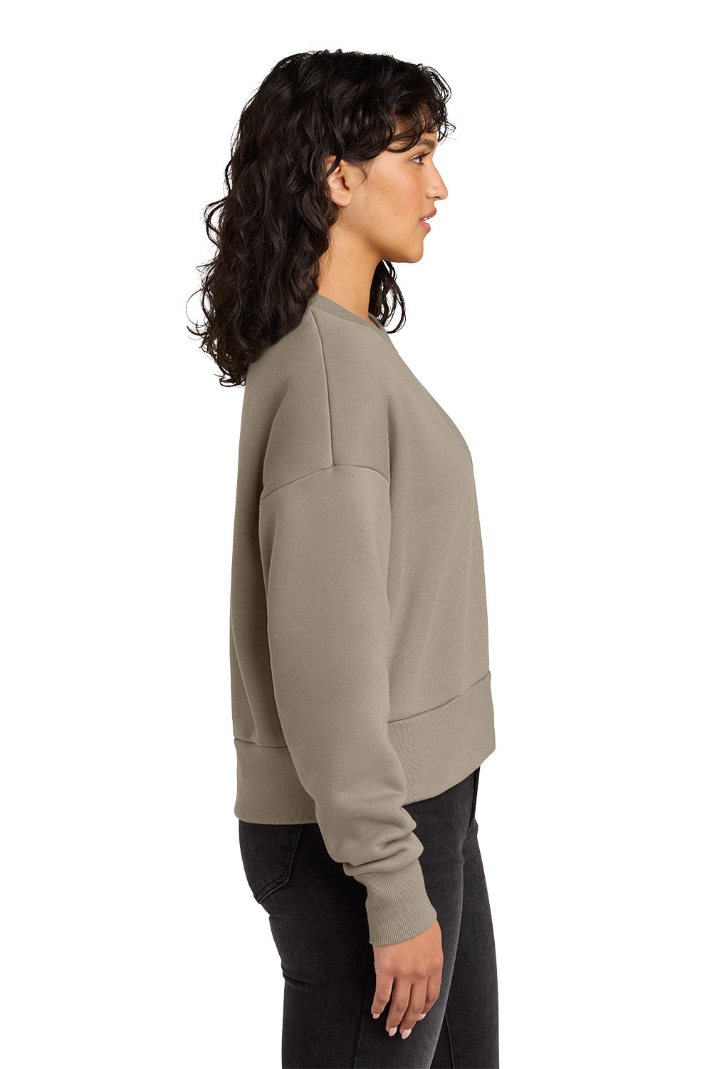 Woman wearing a green sweatshirt on a white background. Next Level Apparel® Women’s Heavyweight Sweatshirt, Embroidered