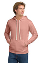 Man wearing a pink hoodie and blue jeans on a white background. v