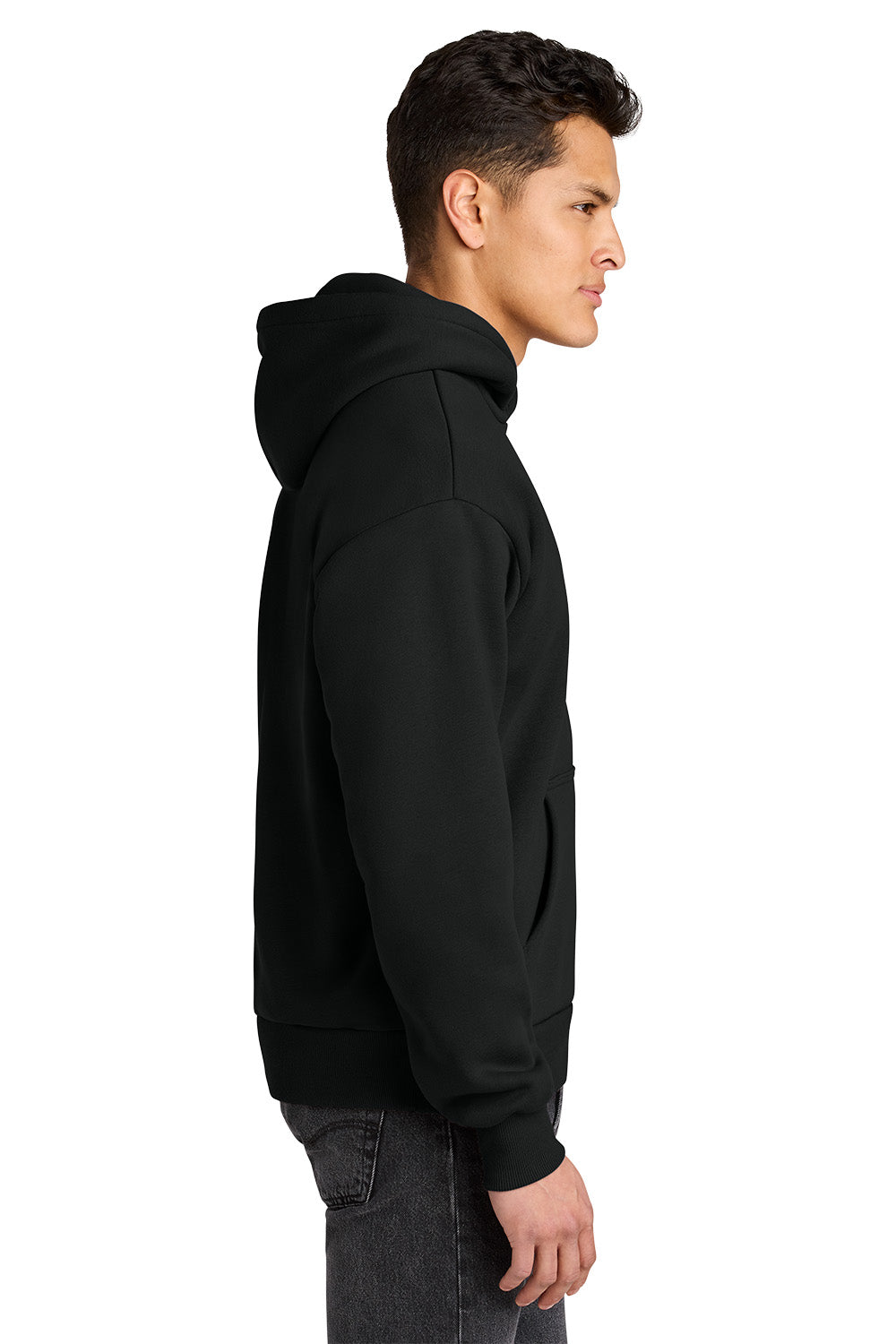 A man in profile wearing a plain black pullover hoodie against a clean white background. Next Level Apparel® Heavyweight Hoodie, Embroidered