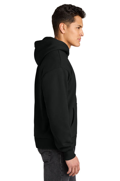 A man in profile wearing a plain black pullover hoodie against a clean white background. Next Level Apparel® Heavyweight Hoodie, Embroidered