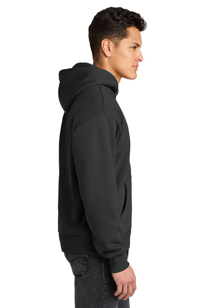 Person wearing a black hoodie on a white background. Next Level Apparel® Heavyweight Hoodie, Embroidered
