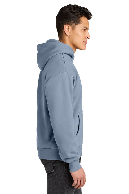 Man wearing a light blue hoodie on a white background. Next Level Apparel® Heavyweight Hoodie, Embroidered