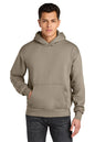 Man wearing a beige hoodie on a white background. Next Level Apparel® Heavyweight Hoodie, Embroidered