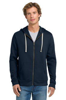 Man wearing a navy blue hoodie with a white zipper on a white background. Next Level Apparel® Adult Santa Barbara Zip Hoodie, Embroidered