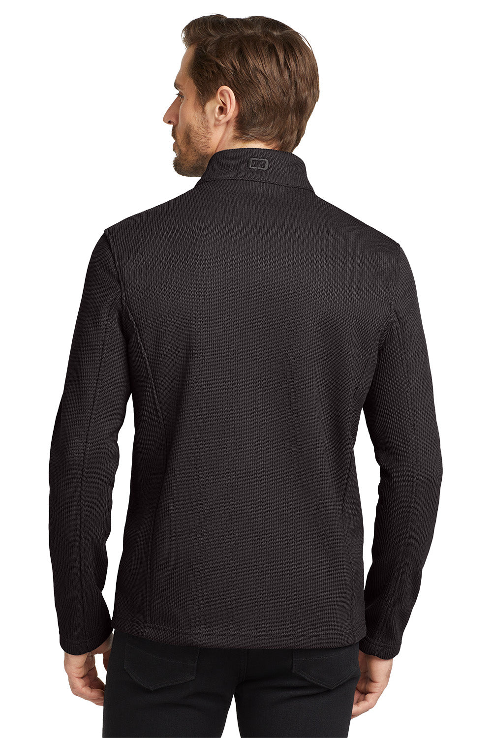 Man wearing a black ribbed long-sleeve shirt on a white background embroidered OGIO® Grit Fleece Jacket