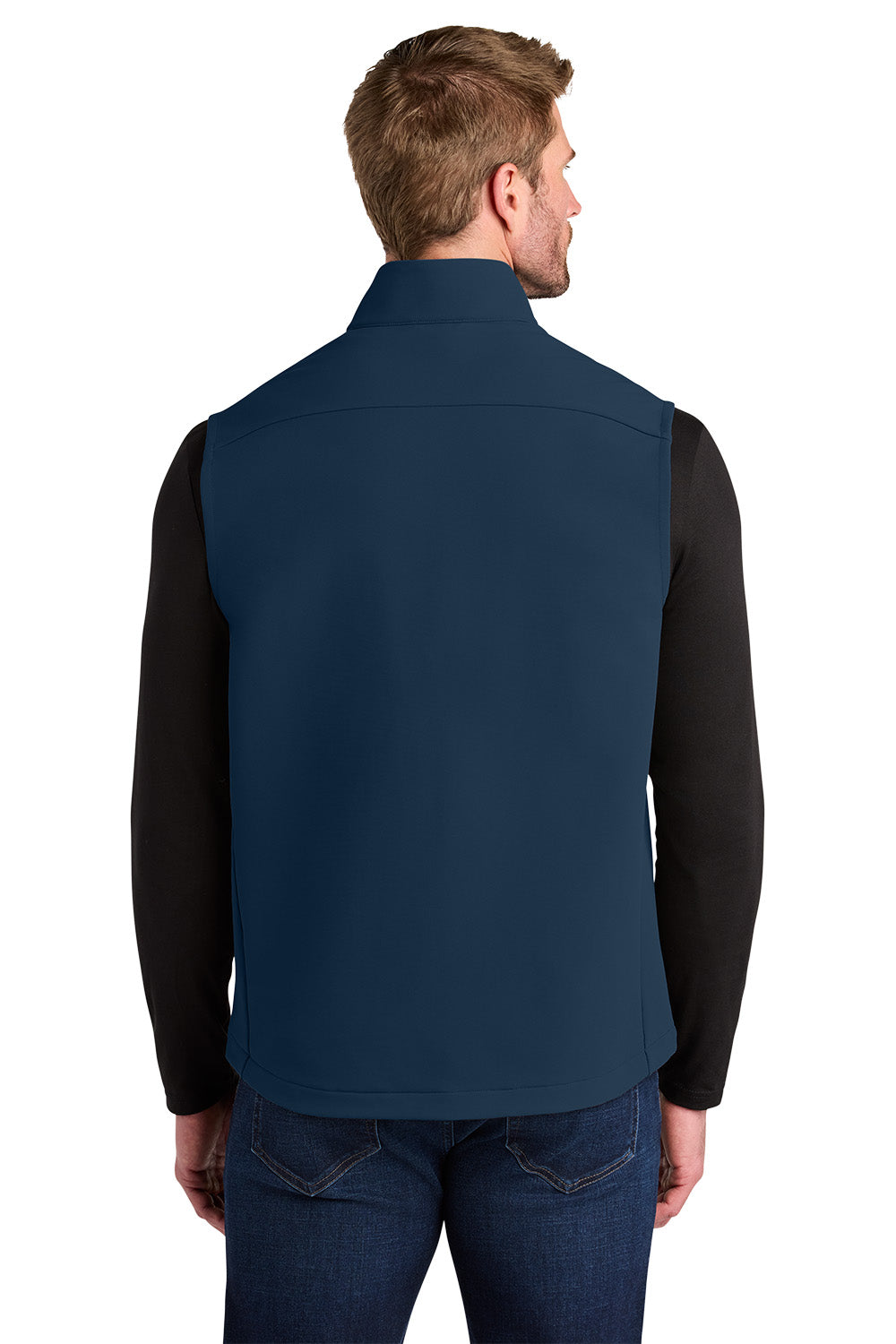 Man wearing a navy blue vest over a black long-sleeve shirt on a white background, Embroidered OGIO® Kinetic Soft Shell Vest