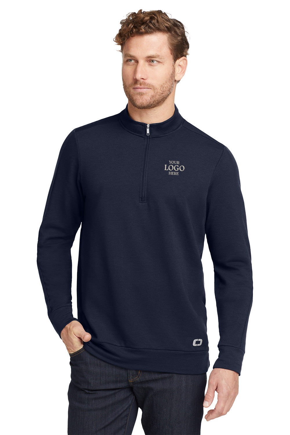 Man wearing a navy blue pullover with a logo on a white background, embroidered OGIO® Luuma 1/2-Zip Fleece