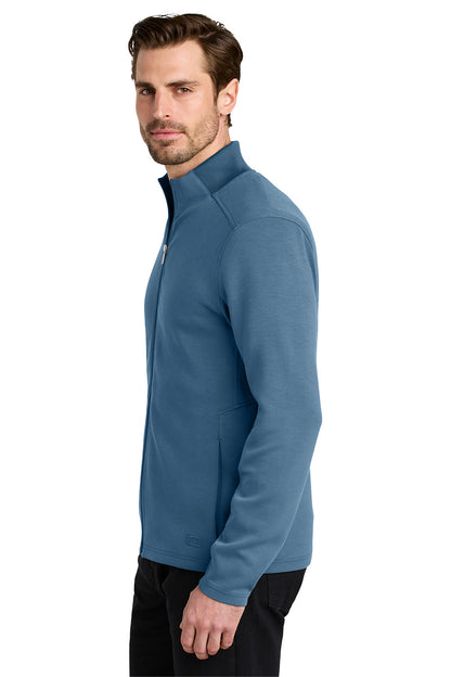 Man wearing a blue fleece jacket on a white background OGIO® Transcend Full-Zip, Embroidered