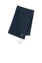 Navy blue towel with a metal clip on a white background. Port Authority Grommeted Hemmed Towel, Embroidered by Helmsman Stitch Co.