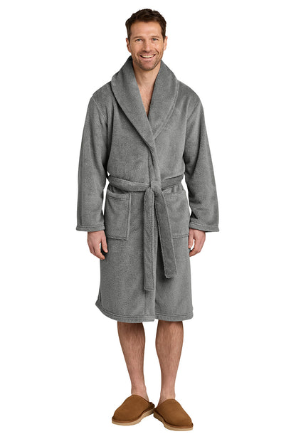 A man wearing a gray plush bathrobe with a shawl collar and tie belt, paired with brown slippers, standing against a plain white background. Port Authority® Dream Plush Robe, Embroidered