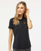 Woman wearing a black Adidas polo shirt on a white background. Adidas Women's Ultimate365 Solid Polo, RAM Logo by Helmsman Stitch Co.