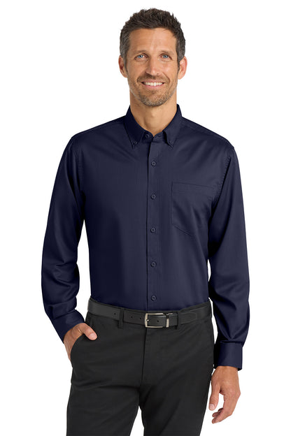 Man wearing a navy button-up shirt and black pants on a white background Port Authority® SuperPro™ Twill Shirt, Embroidered