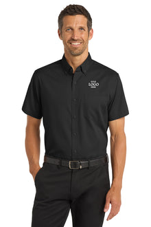 Man wearing a black short-sleeve button-up shirt with a logo on a white background Port Authority® Short Sleeve SuperPro™ Twill Shirt, Embroidered