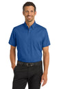 Man wearing a blue short-sleeve shirt and black pants on a white background Port Authority® Short Sleeve SuperPro™ Twill Shirt, Embroidered
