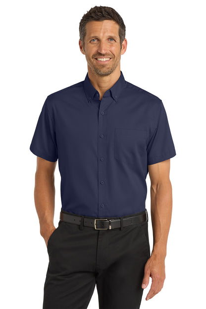 Man wearing a navy short-sleeve button-up shirt and black pants on a white background Port Authority® Short Sleeve SuperPro™ Twill Shirt, Embroidered