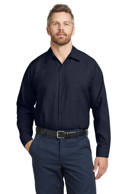 Man wearing a navy button-up shirt and pants on a white background embroidered Red Kap® Long Sleeve Industrial Work Shirt