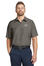 Man wearing a gray short-sleeve shirt with a customizable logo on a white background embroidered Red Kap® Short Sleeve Industrial Work Shirt