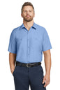 Man wearing a light blue short-sleeve shirt and navy pants on a white background embroidered Red Kap® Short Sleeve Industrial Work Shirt