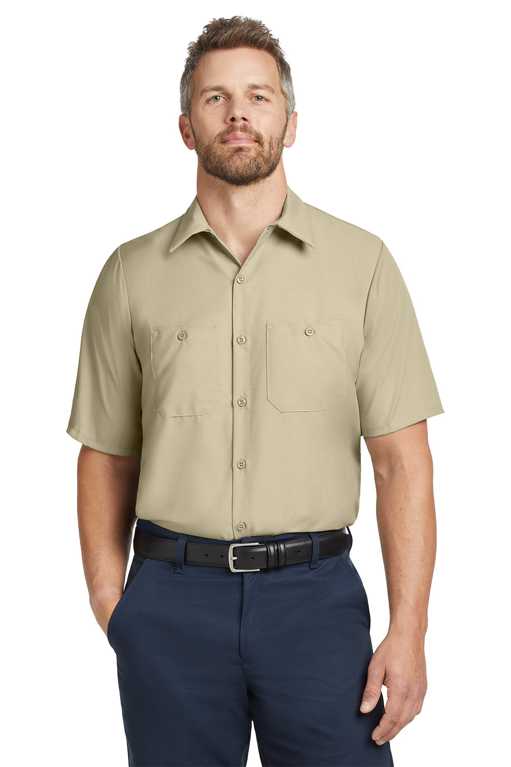 Man wearing a beige short-sleeve shirt and navy pants on a white background embroidered Red Kap® Short Sleeve Industrial Work Shirt