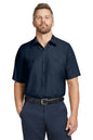 Man wearing a navy blue short-sleeve shirt and pants on a white background embroidered Red Kap® Short Sleeve Industrial Work Shirt