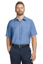 Man wearing a blue short-sleeve shirt and navy pants on a white background embroidered Red Kap® Short Sleeve Industrial Work Shirt