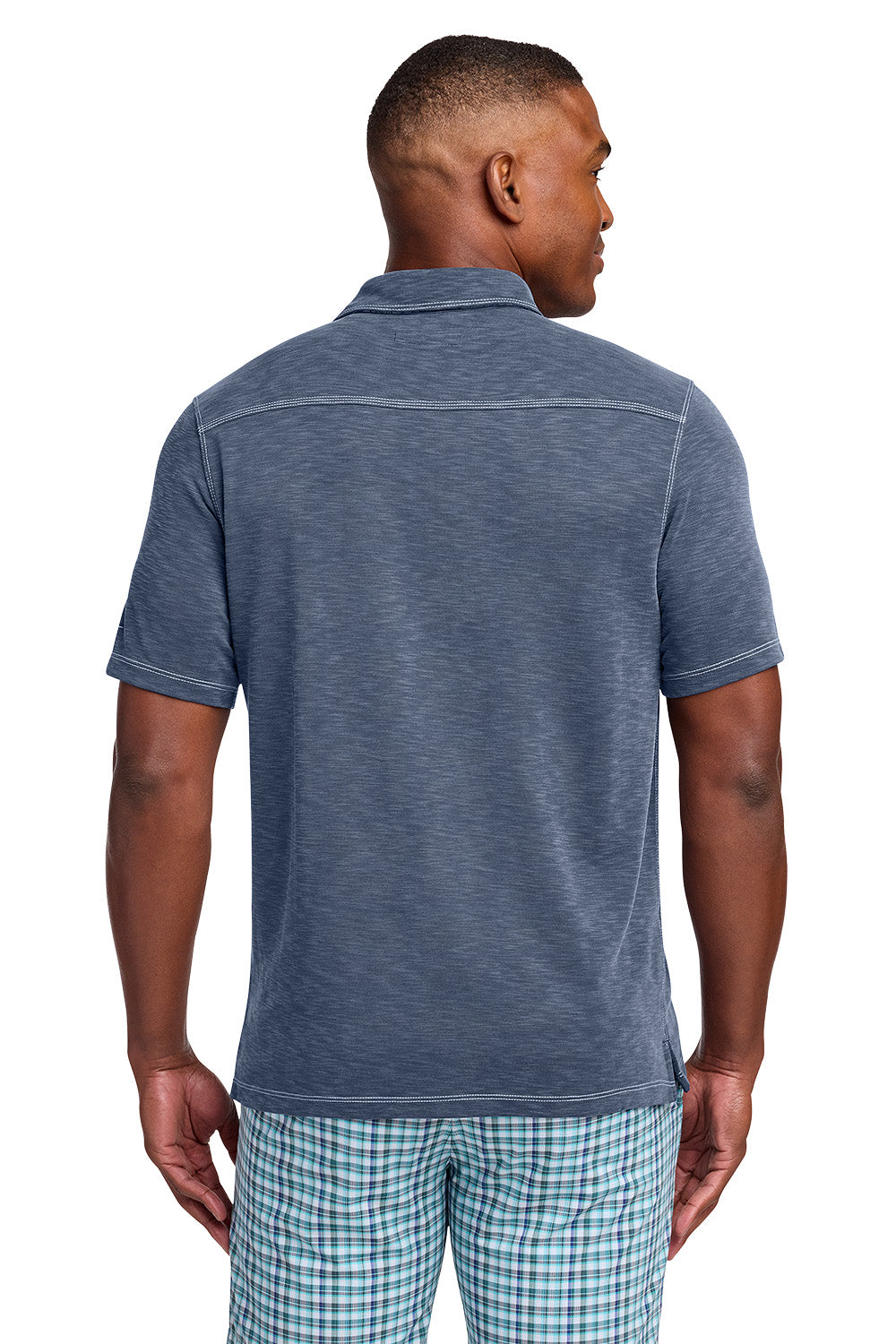 Man wearing a blue polo shirt and plaid shorts on a white background, Tommy Bahama® Palmetto Paradise Polo, Embroidered