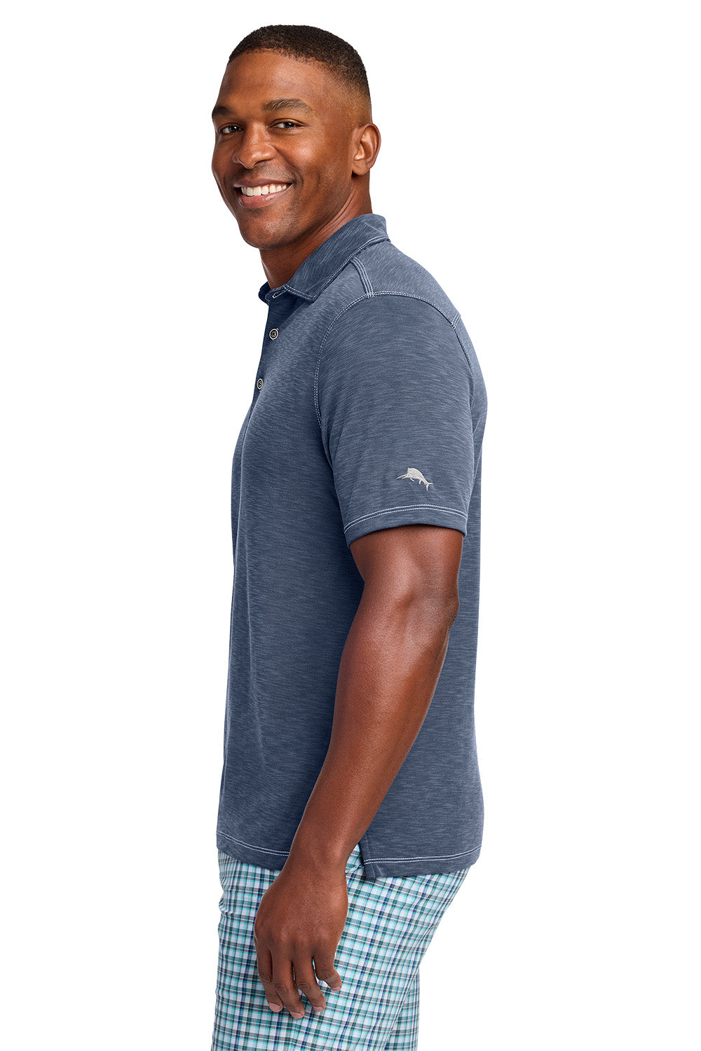 Man wearing a blue polo shirt with a visible brand logo on a white background, Tommy Bahama® Palmetto Paradise Polo, Embroidered