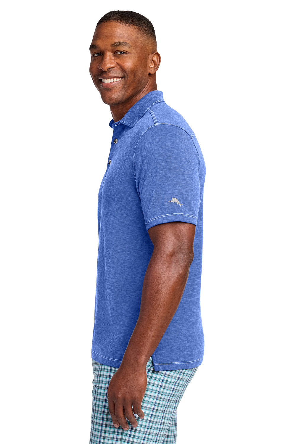 Man wearing a blue polo shirt with a logo on a white background, Tommy Bahama® Palmetto Paradise Polo, Embroidered