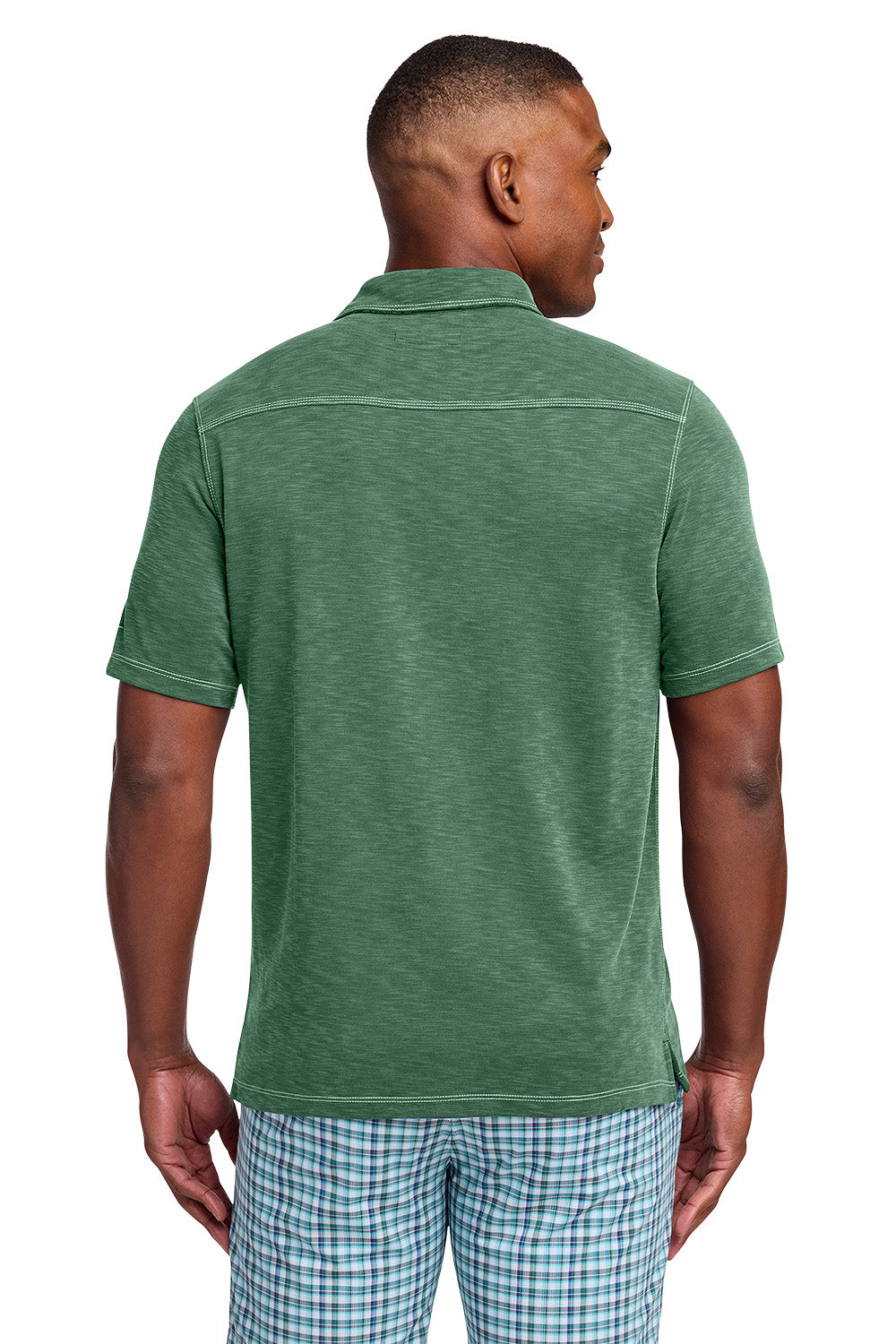 Man wearing a green polo shirt and checkered shorts on a white background, Tommy Bahama® Palmetto Paradise Polo, Embroidered