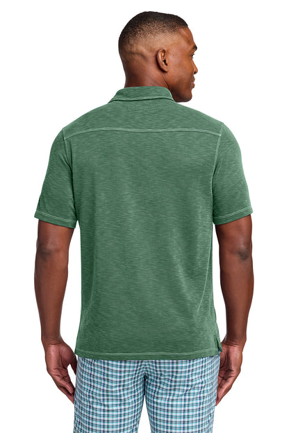 Man wearing a green polo shirt and checkered shorts on a white background, Tommy Bahama® Palmetto Paradise Polo, Embroidered
