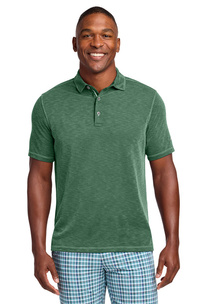Man wearing a green polo shirt and plaid shorts on a white background, Tommy Bahama® Palmetto Paradise Polo, Embroidered