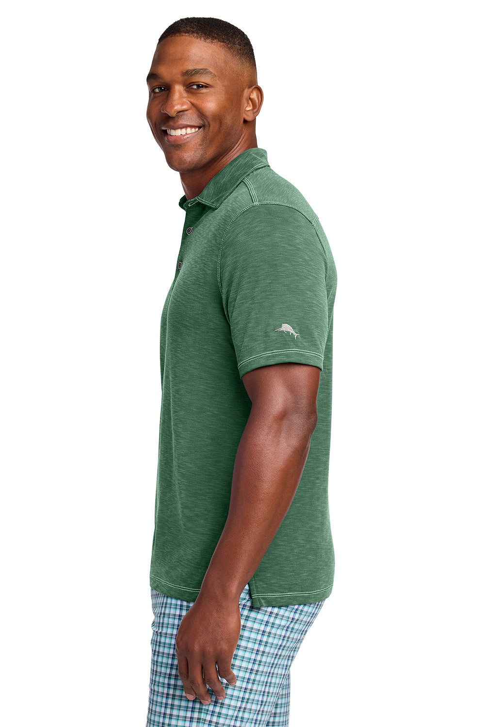Man wearing a green polo shirt with a visible brand logo on a white background, Tommy Bahama® Palmetto Paradise Polo, Embroidered