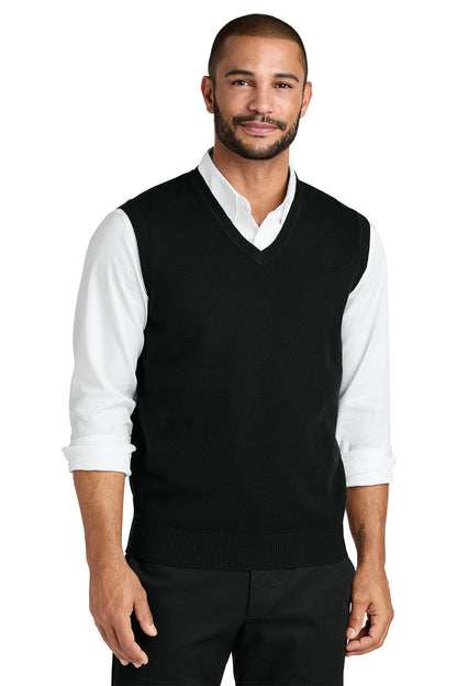 Man wearing a black sweater vest over a white shirt on a white background. Port Authority® Easy Care Sweater Vest, Embroidered