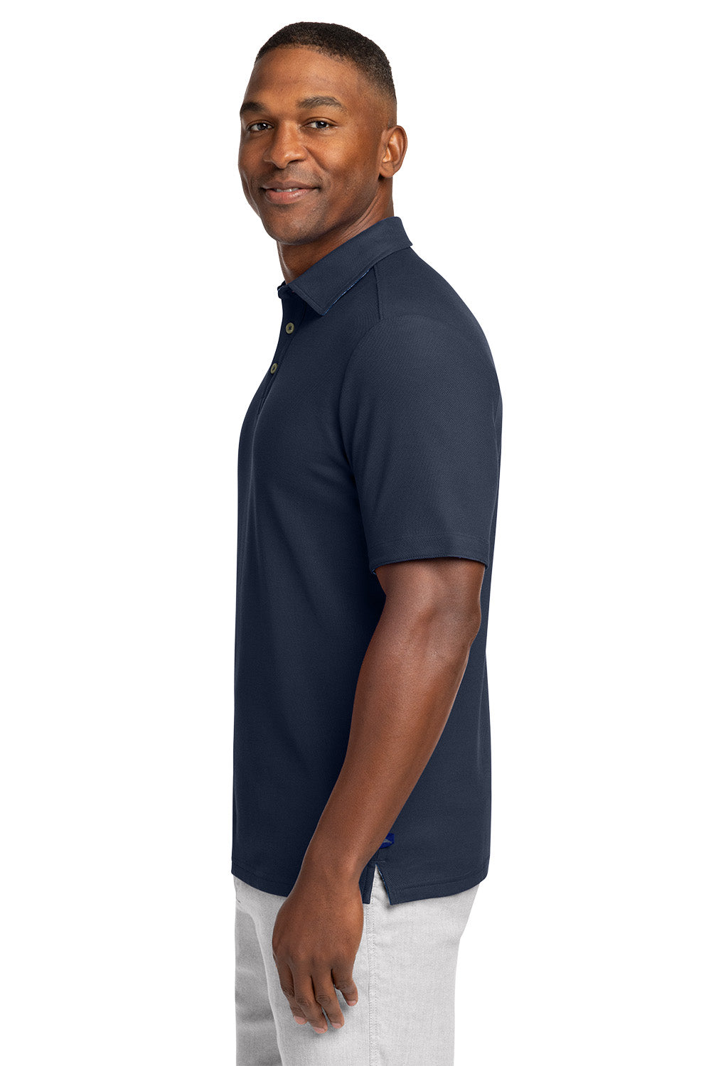 Man wearing a navy polo shirt on a white background Tommy Bahama® 5 O’Clock Polo, Embroidered