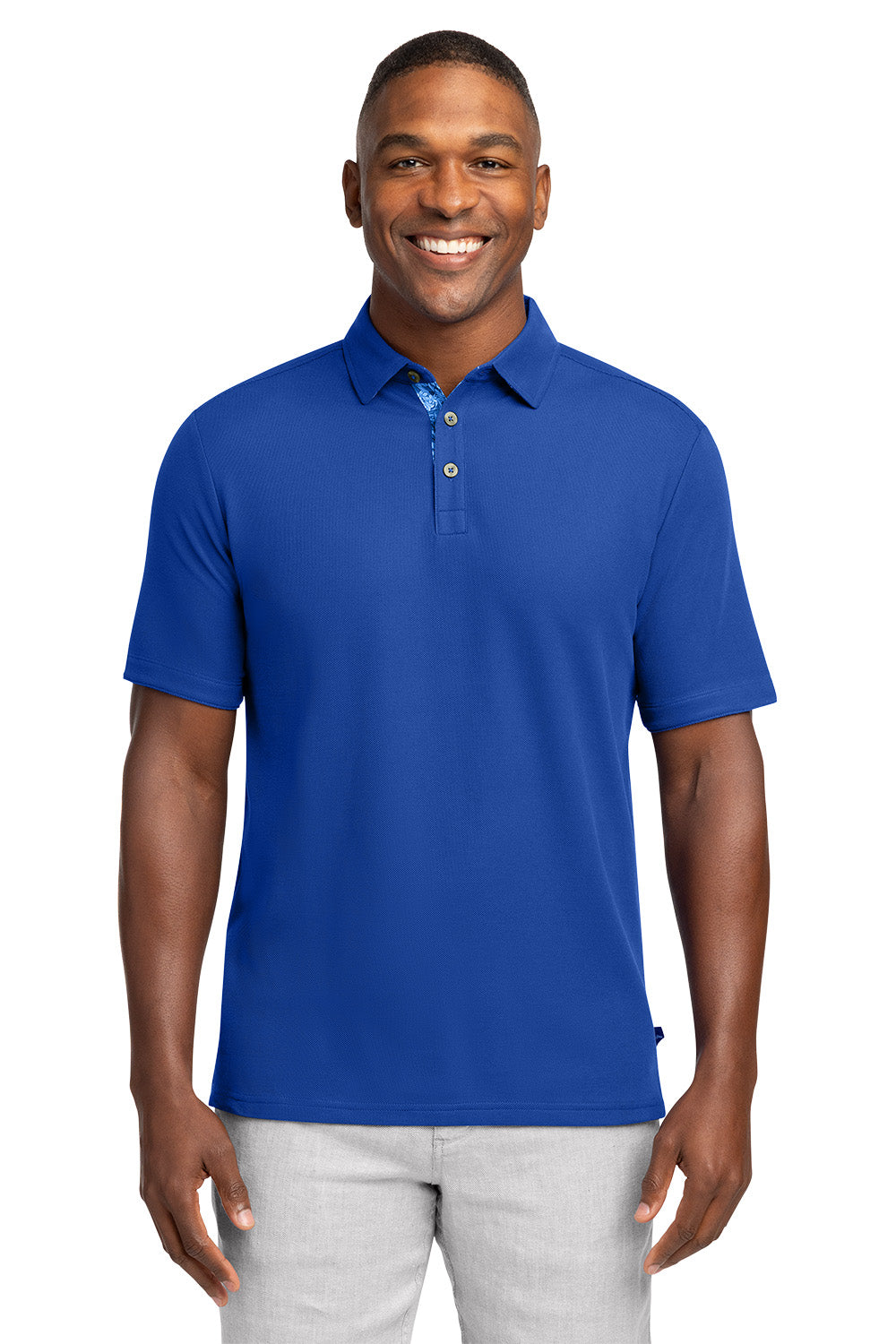 Man wearing a blue polo shirt on a white background Tommy Bahama® 5 O’Clock Polo, Embroidered