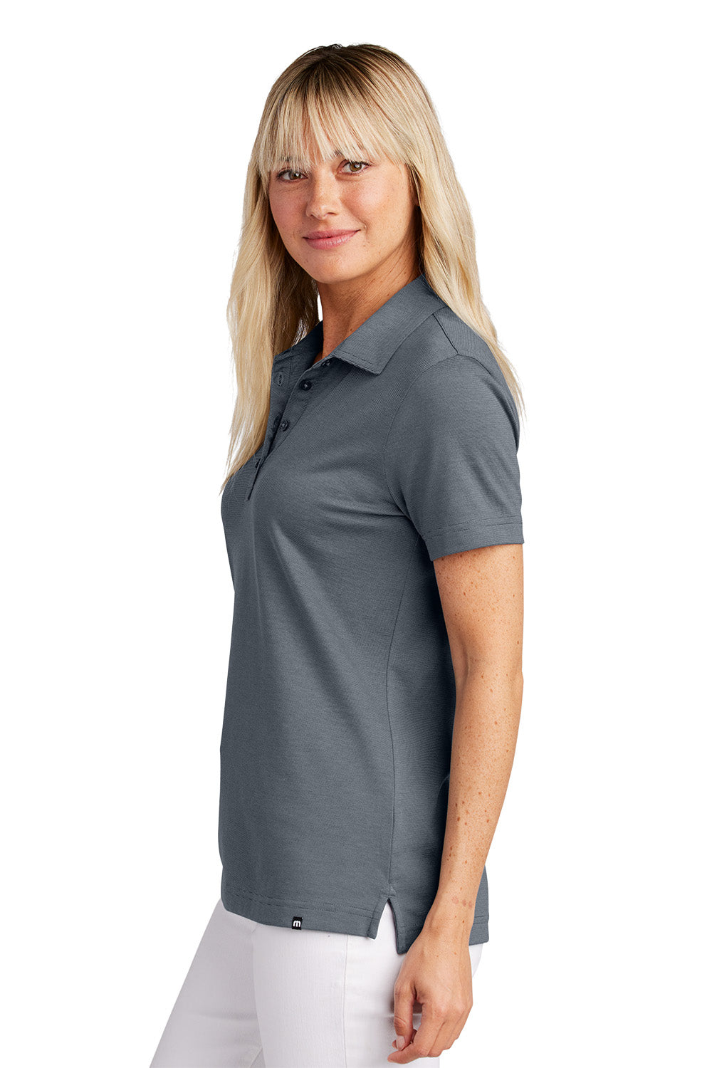 Woman wearing a gray polo shirt on a white background, Embroidered TravisMathew Women's Sunnyvale Polo