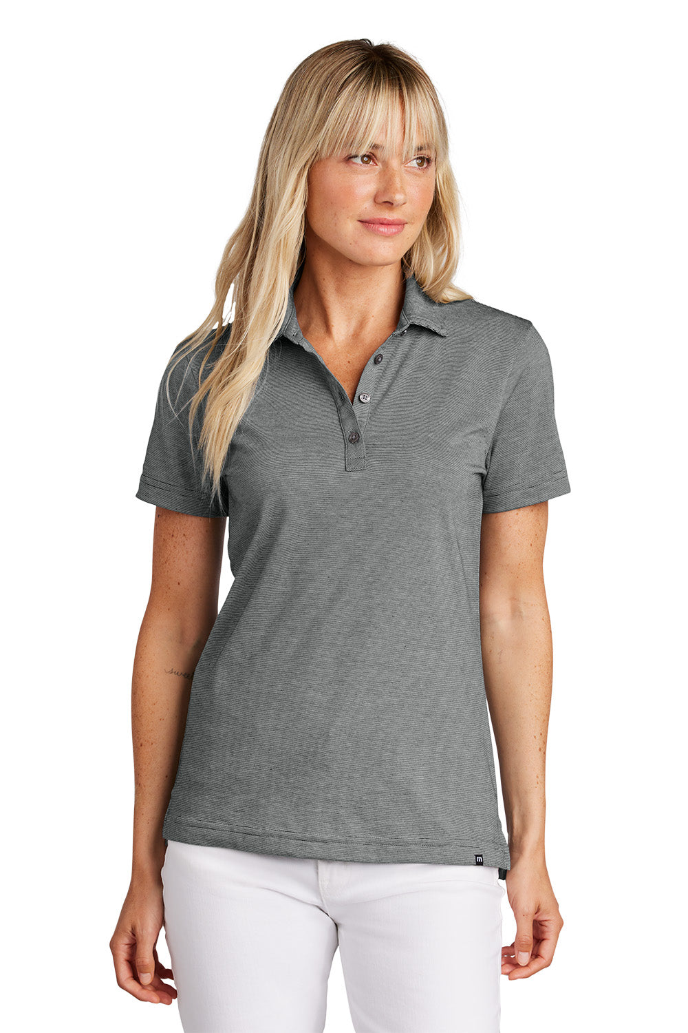 Woman wearing a gray polo shirt on a white background, Embroidered TravisMathew Women's Sunnyvale Polo