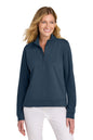 Woman wearing a navy blue pullover with a quarter zip on a white background TravisMathew Women's Coveside 1/2-Zip, Embroidered