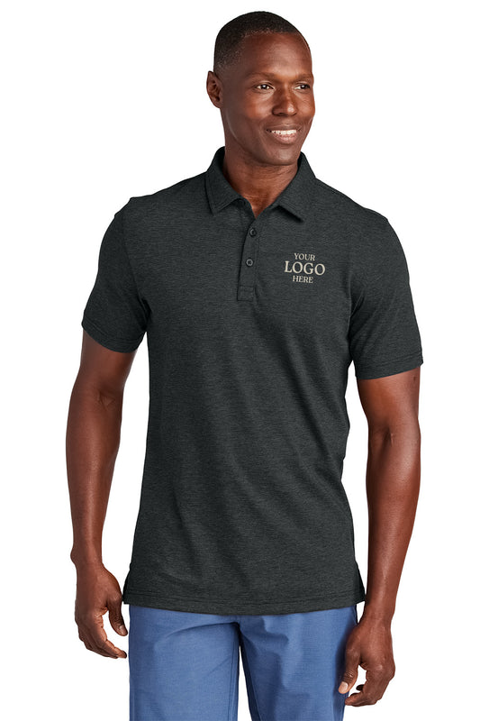 Man wearing a dark gray polo shirt with customizable text on a white background, Embroidered TravisMathew Sunnyvale Polo