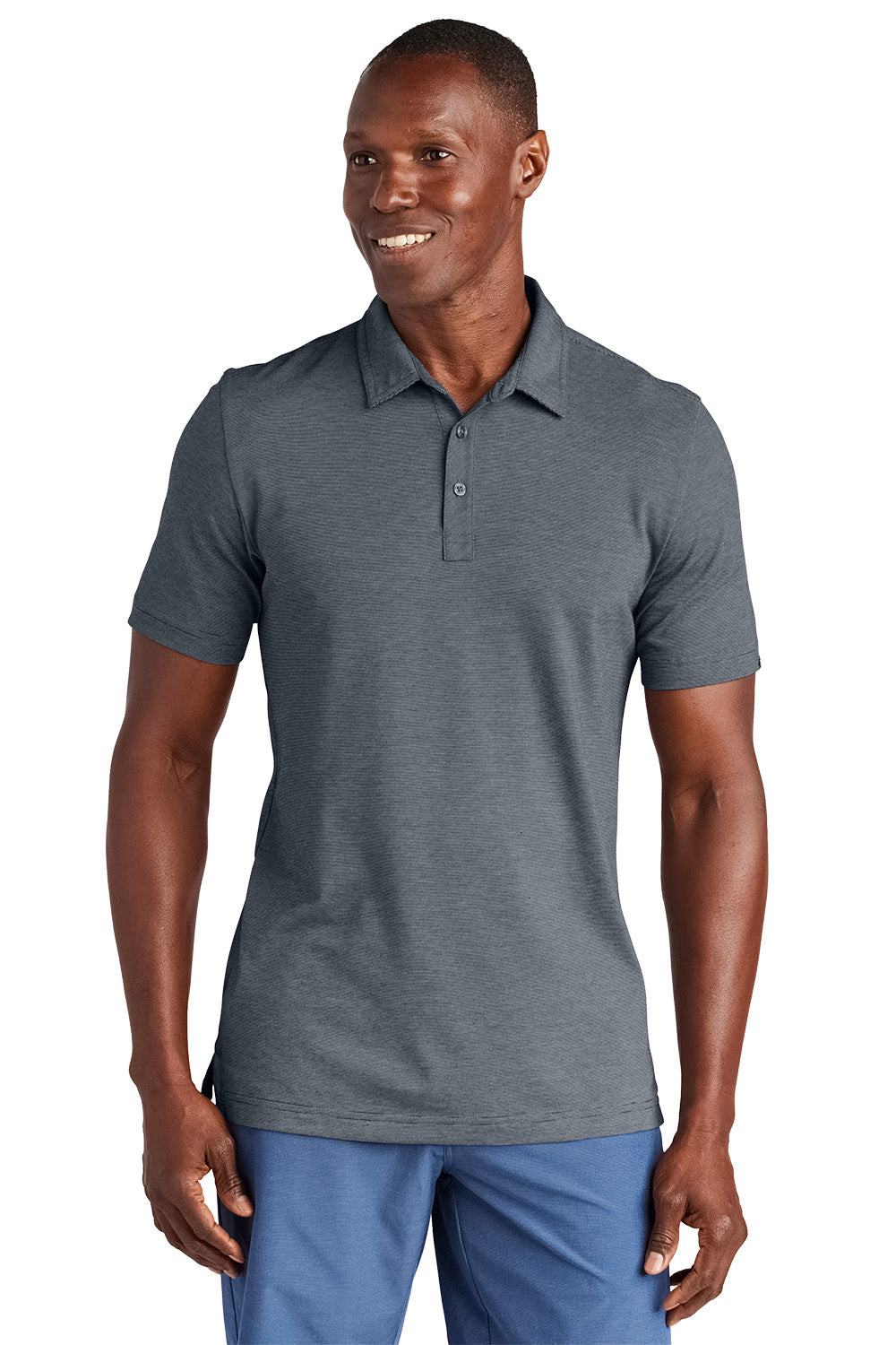 Man wearing a gray polo shirt and blue pants on a white background, Embroidered TravisMathew Sunnyvale Polo
