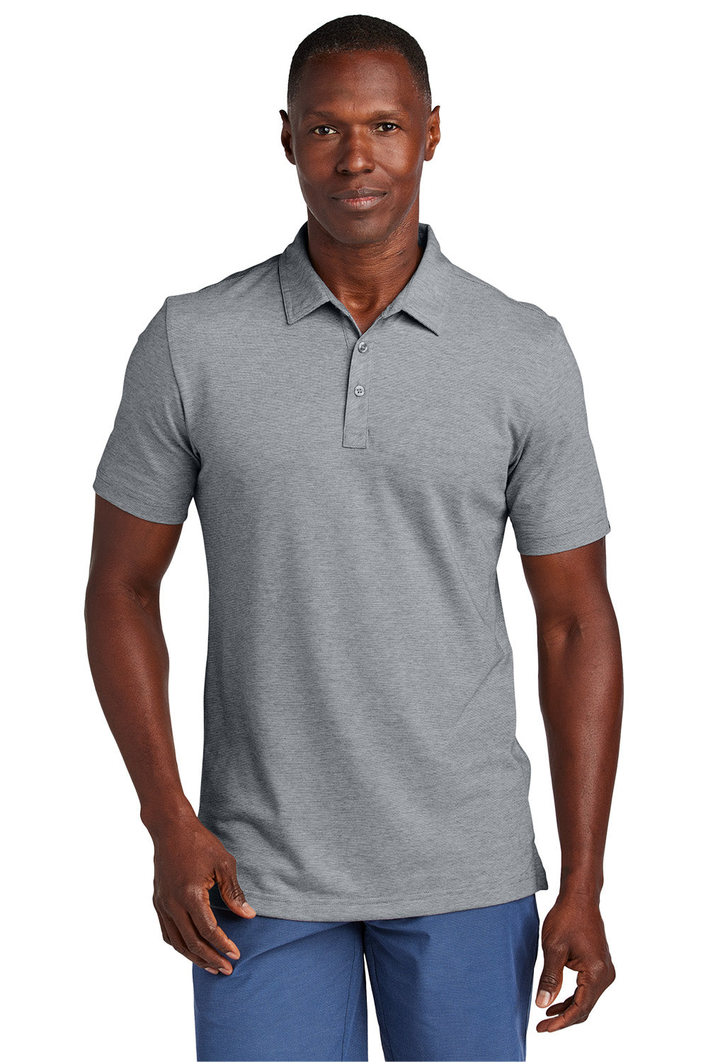 Man wearing a gray polo shirt and blue pants on a white background, Embroidered TravisMathew Sunnyvale Polo