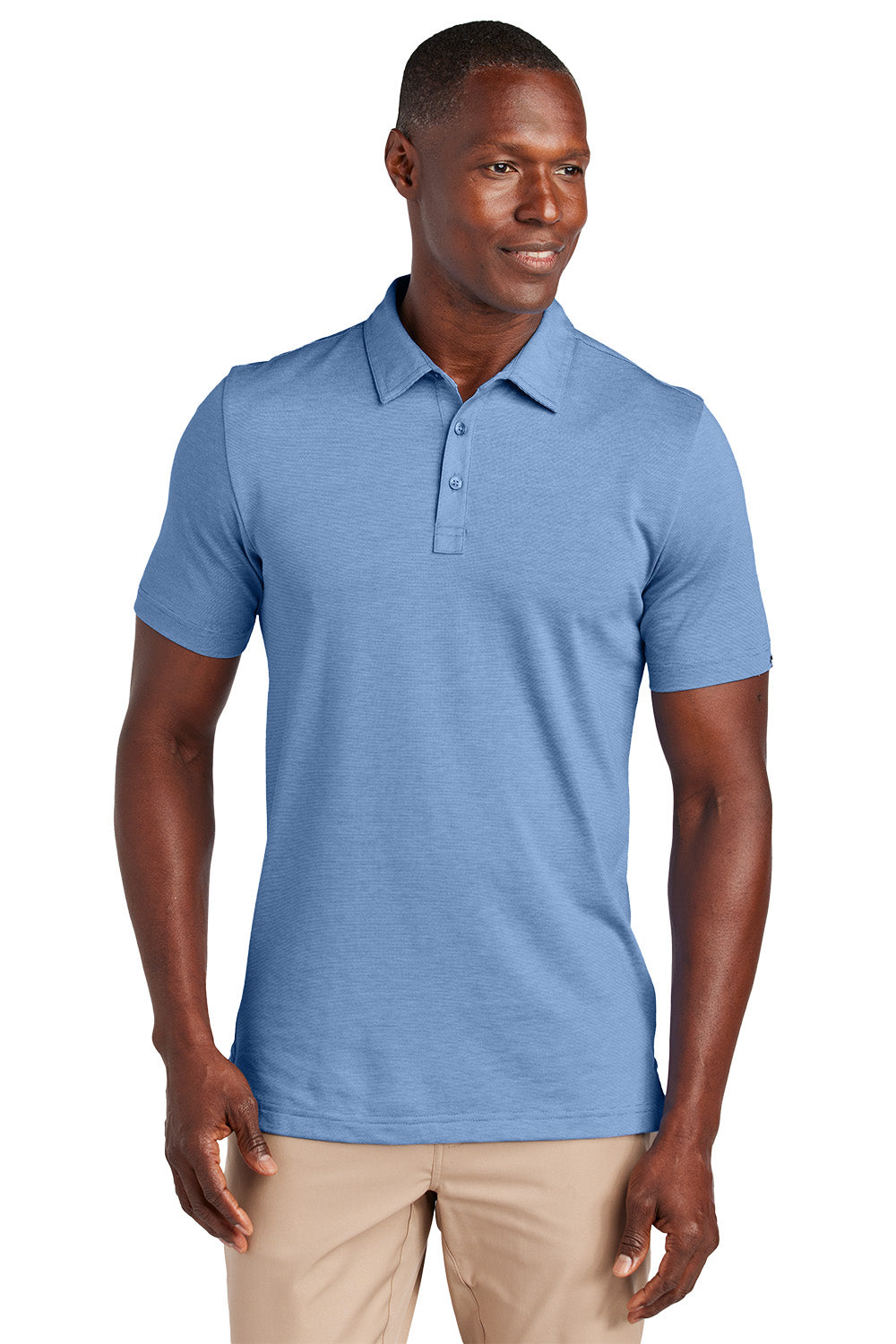 Man wearing a blue polo shirt on a white background, Embroidered TravisMathew Sunnyvale Polo