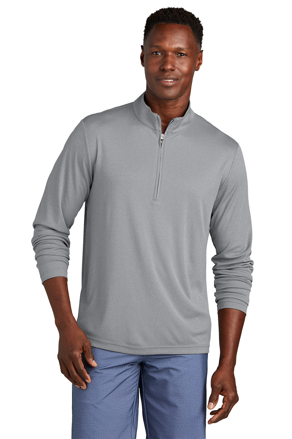 Man wearing a gray long-sleeve pullover with a quarter zip on a white background, embroidered TravisMathew Coto Performance 1/4-Zip