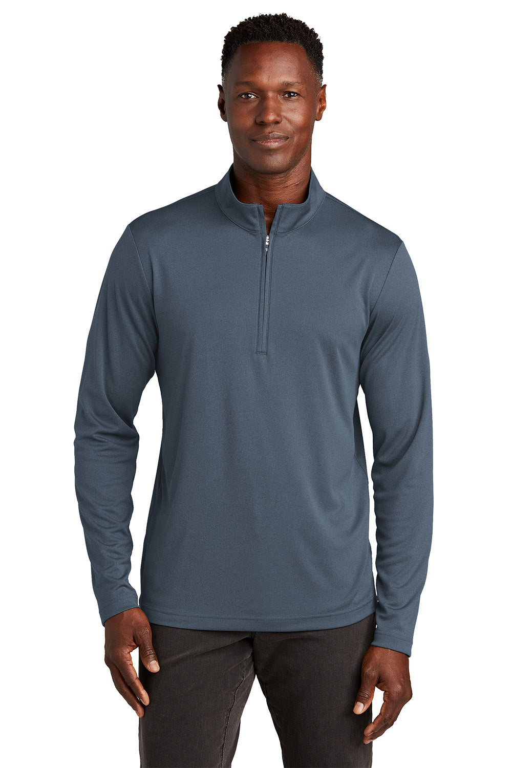 Man wearing a gray long-sleeve shirt with a quarter zip on a white background, embroidered TravisMathew Coto Performance 1/4-Zip