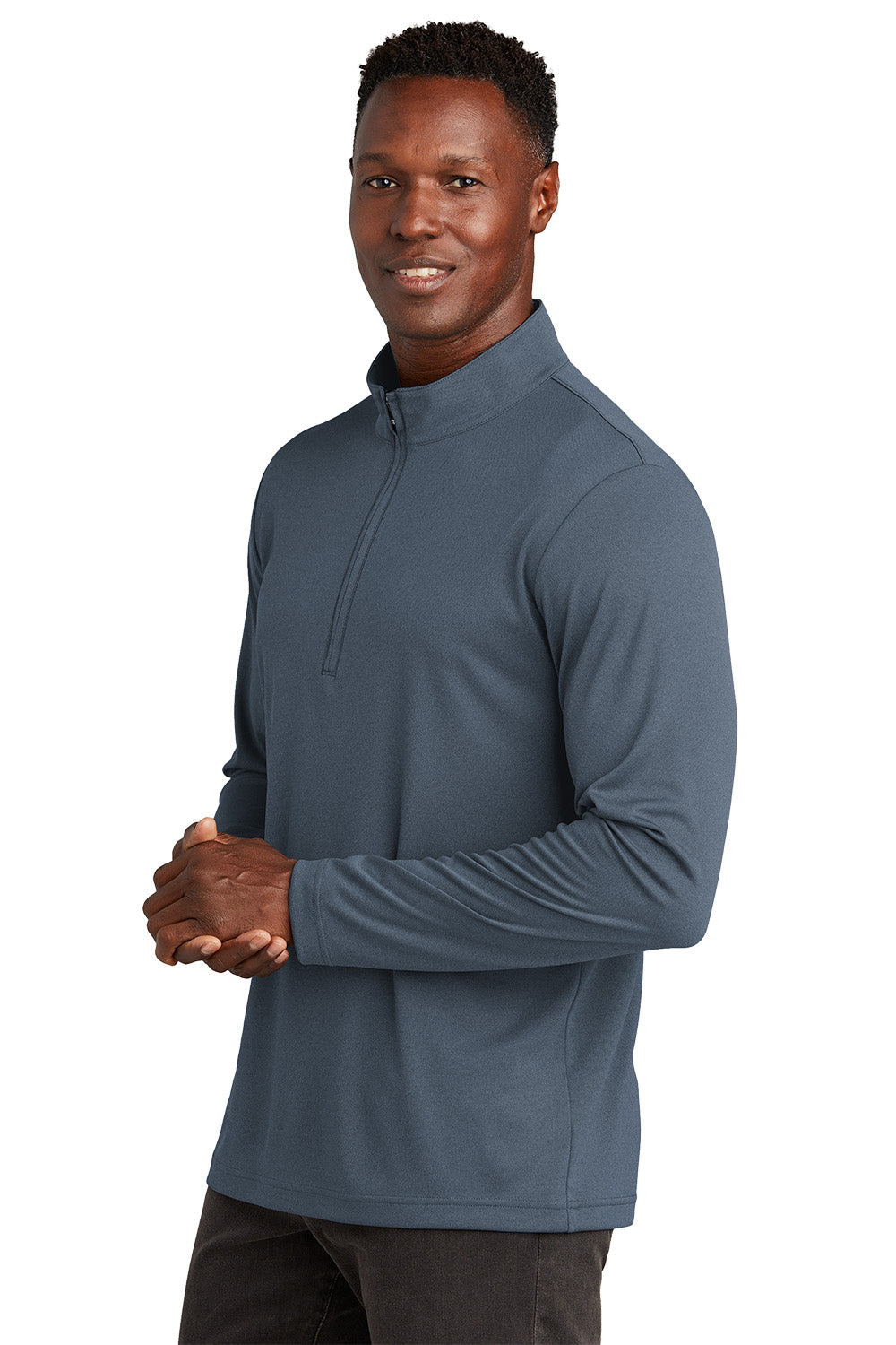 Man wearing a blue pullover with a quarter zip on a white background, embroidered TravisMathew Coto Performance 1/4-Zip