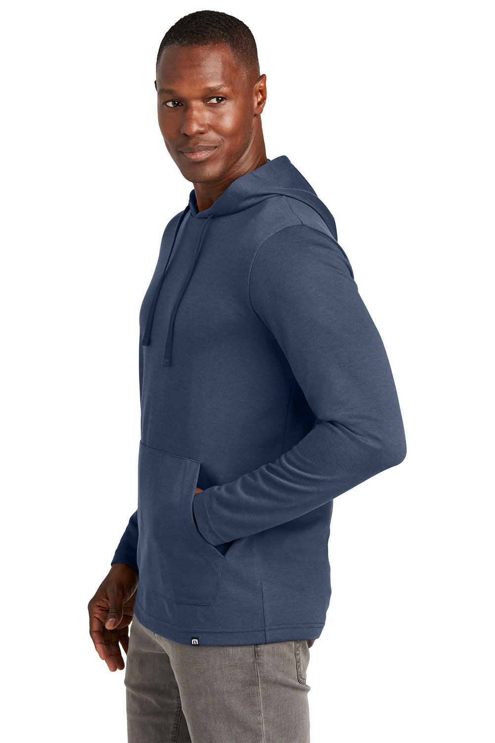 Man wearing a blue hoodie on a white background TravisMathew Coveside Hoodie, Embroidered